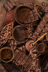 Cocoa beans and chocolate on natural paper background