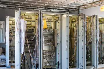 Relay hall with a variety of wires in the process of installation