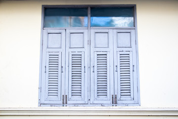 window with blue shutters
