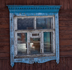 old wooden window in a wooden house