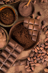 Cocoa beans and chocolate on natural paper background