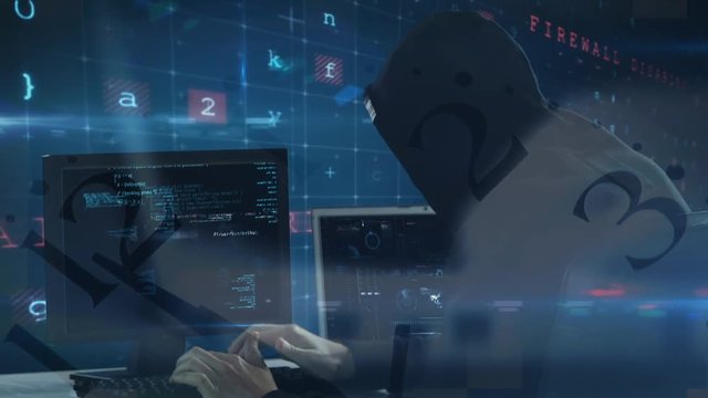 Hacker using computer in dark room