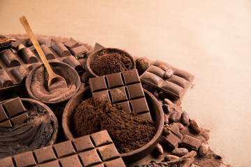 Cocoa beans and chocolate on natural paper background