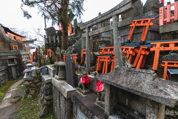 Fox altar and Torii Gates in Fushimi Inari-taisha shrine, Kyoto, Japan