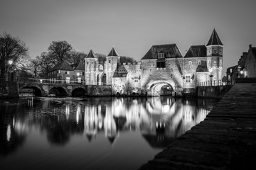 Fototapeta na wymiar Medieval city gate as entrance over a flowing river; eem, in Amersfoort holland