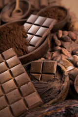 Cocoa beans and chocolate on natural paper background