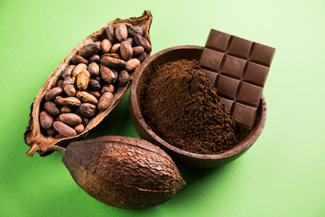 Cocoa beans and chocolate on natural paper background