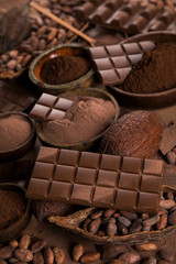 Cocoa beans and chocolate on natural paper background