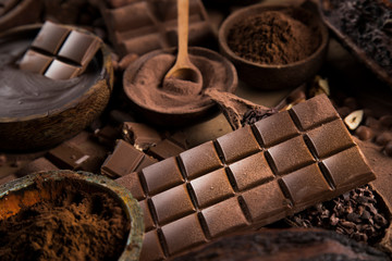 Cocoa beans and chocolate on natural paper background