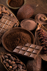 Cocoa beans and chocolate on natural paper background
