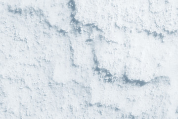 Fresh snow background texture. Winter background with snowflakes and snow mounds. Snow lumps.