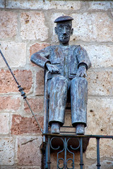 representación hombre sentado, Riaza