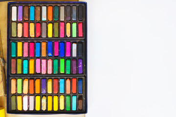 Pastel crayons paint special palette box.  Accessories and tools of the artist for drawing with copy space.