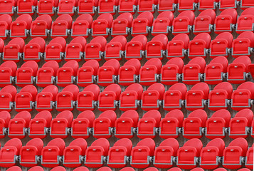 folded red seats in stadium detail