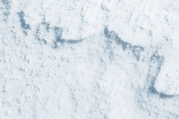 Fresh snow background texture. Winter background with snowflakes and snow mounds. Snow lumps.