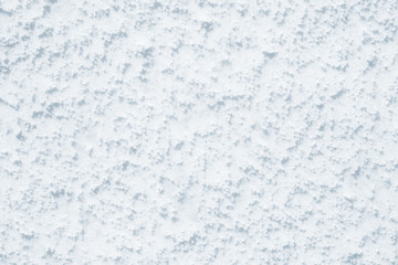 Fresh snow background texture. Winter background with snowflakes and snow mounds. Snow lumps.