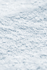 Fresh snow background texture. Winter background with snowflakes and snow mounds. Snow lumps.