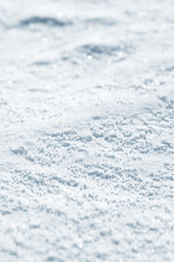 Obraz premium Fresh snow background texture. Winter background with snowflakes and snow mounds. Snow lumps.