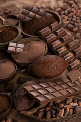 Cocoa beans and chocolate on natural paper background