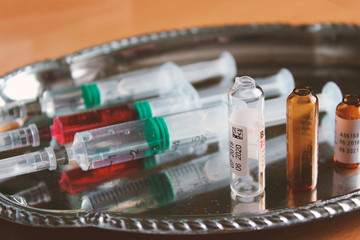 Syringes lying on a tray. Close-up. Background. Texture.