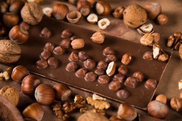 Cocoa beans and chocolate on natural paper background