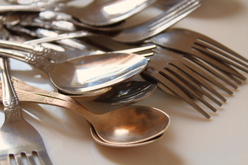 Old metal spoons and forks. Close-up. Background. Texture.