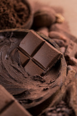 Cocoa beans and chocolate on natural paper background