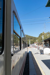 A bunch of friends in their 50's practice mountain hiking at spring time
