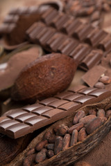 Cocoa beans and chocolate on natural paper background