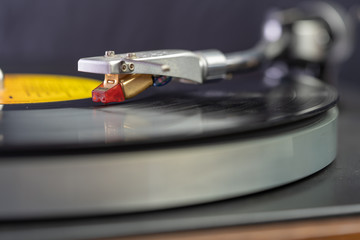 Fototapeta na wymiar Vintage Record Player Needle Closeup On Album