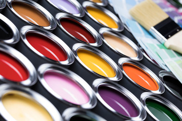 Tin cans with paint and brushes