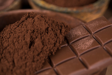 Dark homemade chocolate bars and cocoa