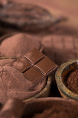 Dark homemade chocolate bars and cocoa