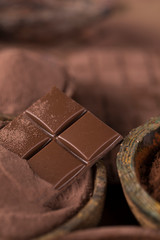 Dark homemade chocolate bars and cocoa