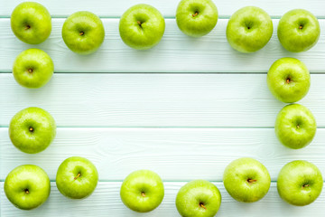 summer fruit pattern with apples on light wooden background top view copyspace