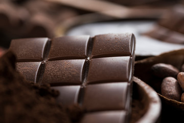 Cocoa beans and chocolate on natural paper background