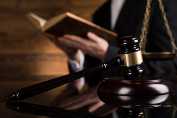 Judge, male judge in a courtroom striking the gavel
