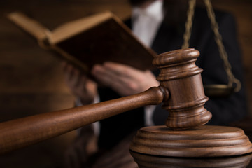 Judge, male judge in a courtroom striking the gavel