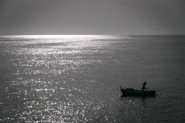 Obraz premium Boat at sunset