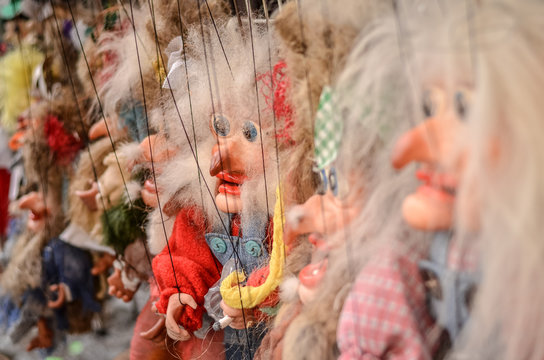 Colorful marionette witches for sale on the streets. Selective focus.
