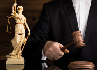 Judge, male judge in a courtroom striking the gavel