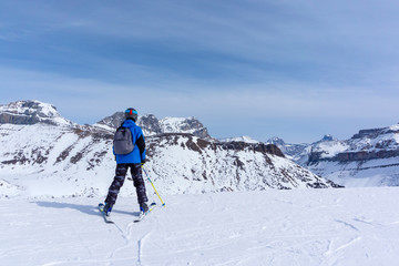 Fototapeta na wymiar Young Skier on Mountain Edge at Lake Louise in the Canadian Rockies
