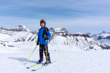 Fototapeta na wymiar Young Skier on Mountain Edge at Lake Louise in the Canadian Rockies