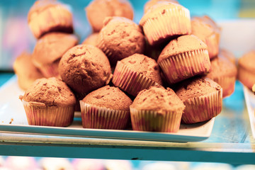 Chocolate muffins on a baking paper top view