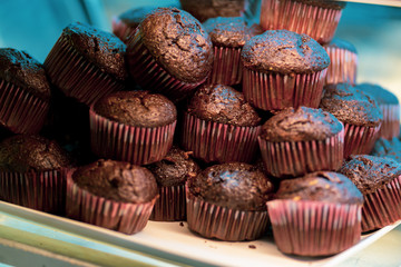 Chocolate muffins on a baking paper top view