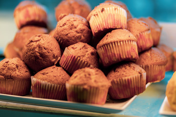 Chocolate muffins on a baking paper top view
