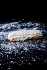 Eclair on black background