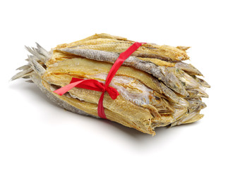 Dried salted fishes on white background