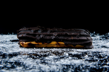 Eclair on black background
