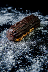 Eclair on black background